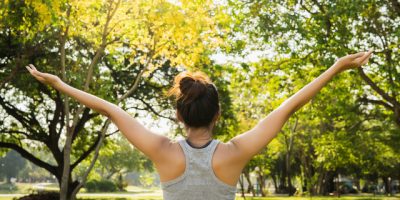 Healthy young Asian runner woman warm up the body stretching before exercise and yoga near lake at park under warm light morning. Lifestyle fitness and active women exercise in urban city concept. (Healthy young Asian runner woman warm up the body str